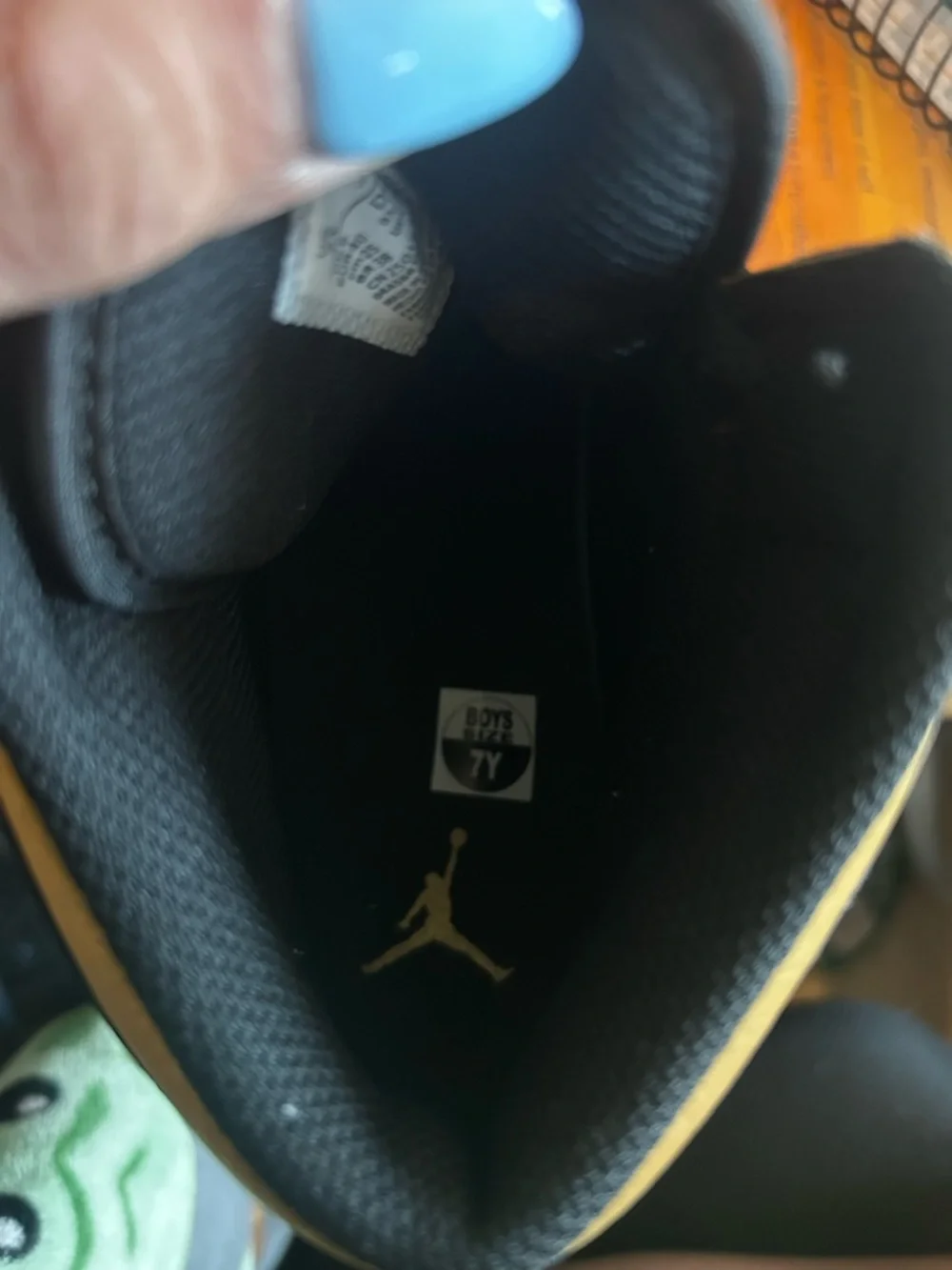 Air Jordan 1 Black and Gold Mid-Top Sneaker